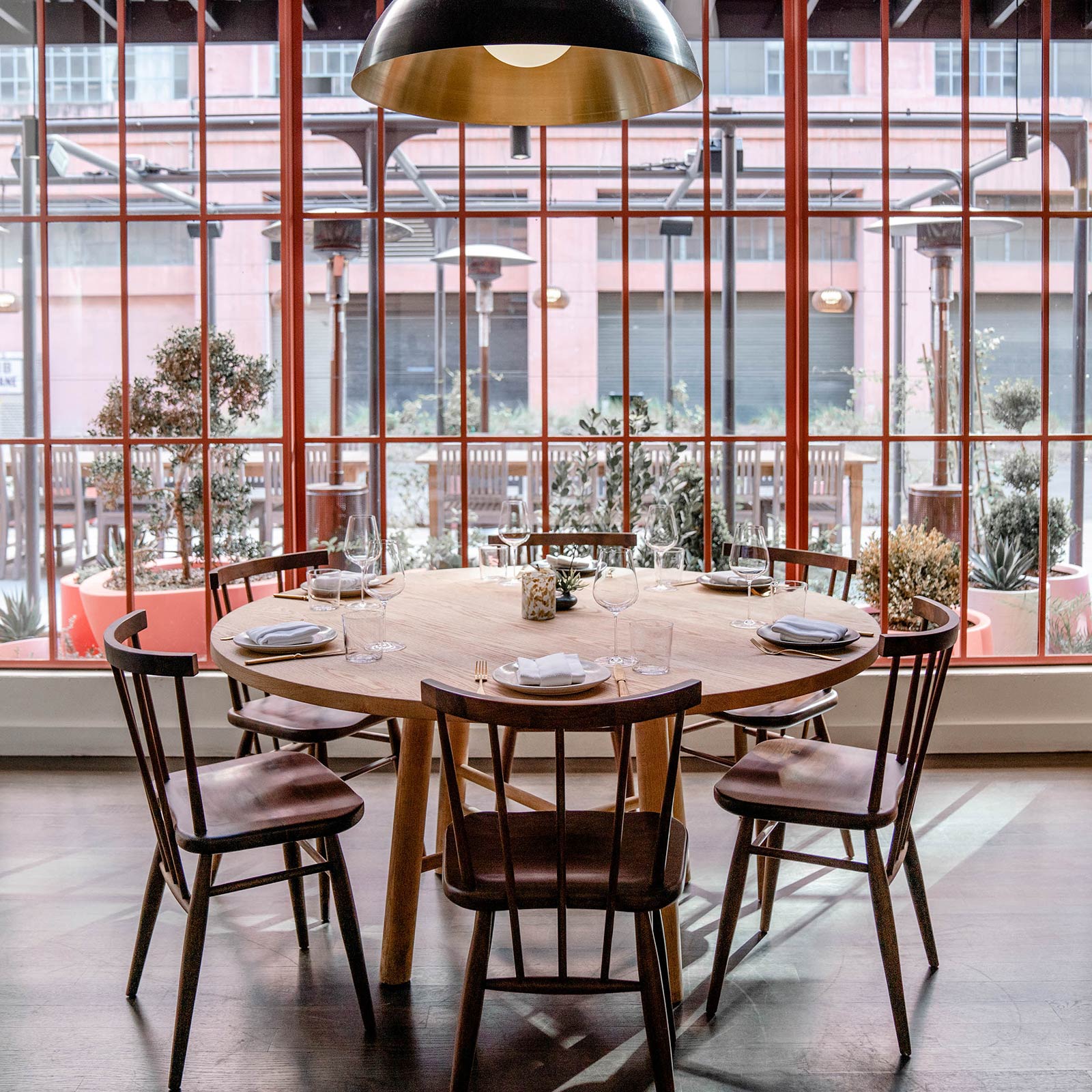 restaurant interior with wooden table and wooden chairs and windows