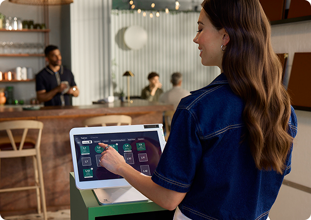 Restaurant host updates seating chart on point of sale screen.