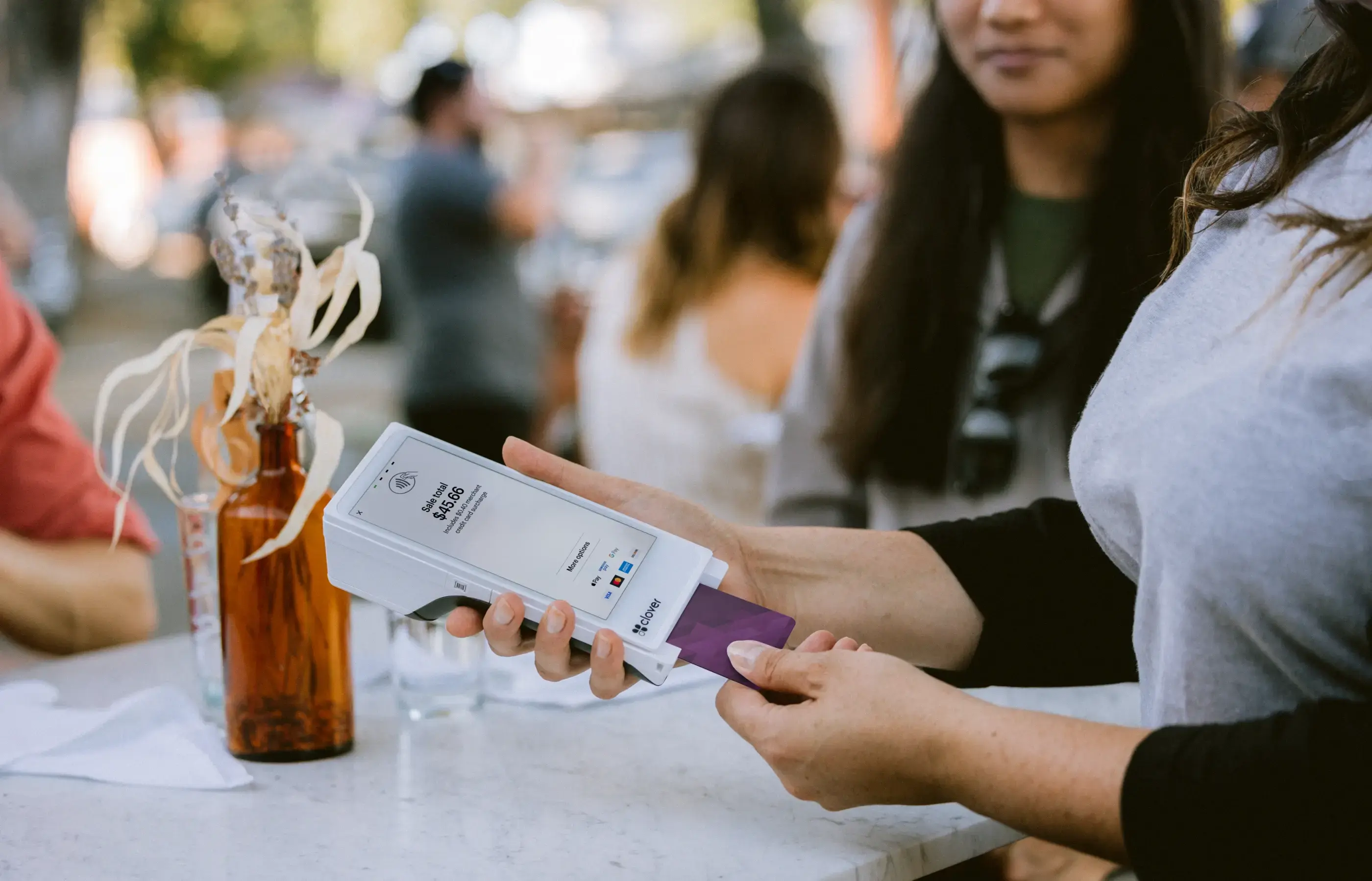 Barbershop taking a payment on Flex