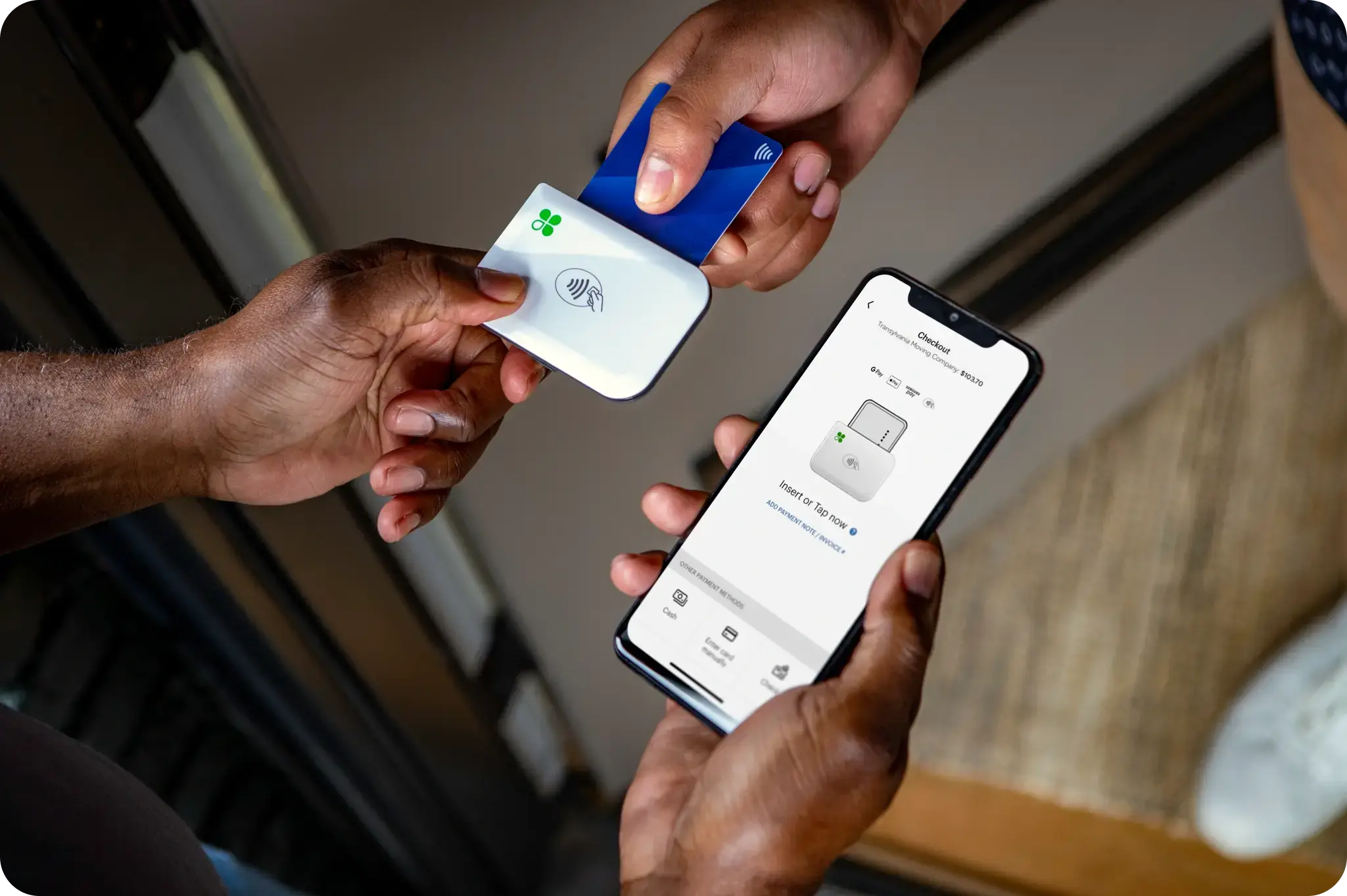 Customer inserting credit card into Go card reader to may for moving services