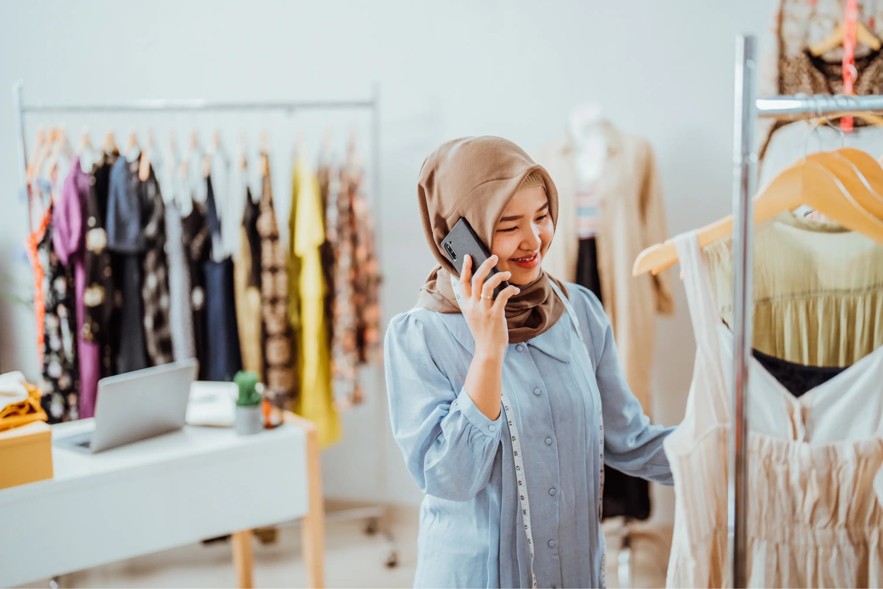 woman wearing hijab shopping in retail store