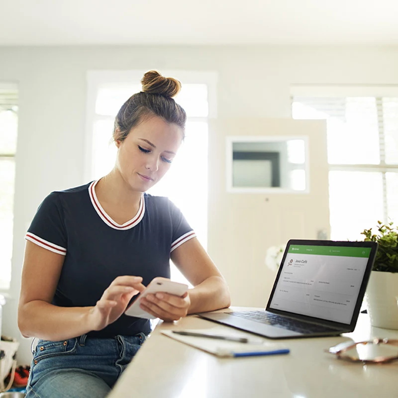 woman at counter on phone