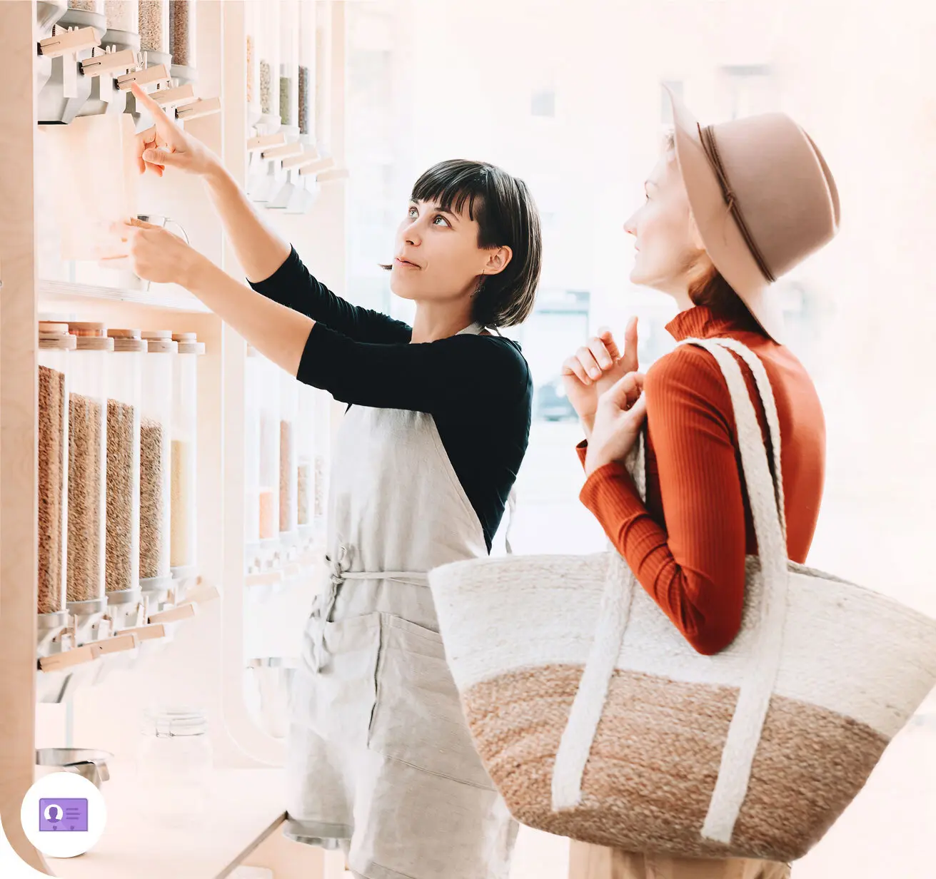 Worker showing customer how to use equipment in the store