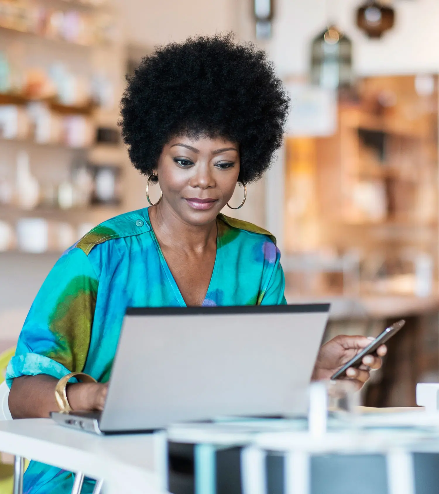 Woman sitting at a desk and working on laptop