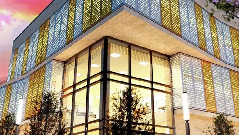 Modern building with large windows and sunset sky