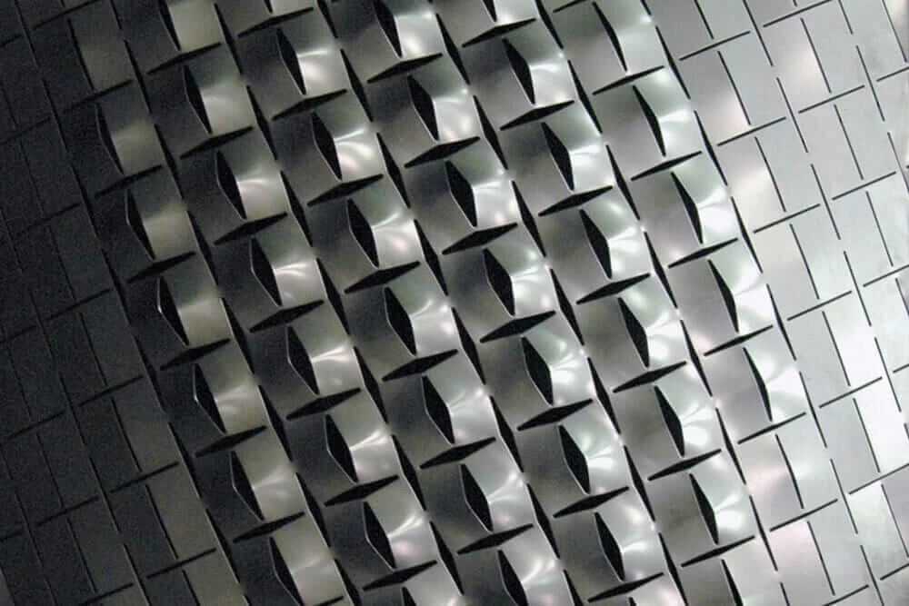 This self-shaping example from 2009—with its variable openings—has implications for building facades, ceilings, and wall systems.