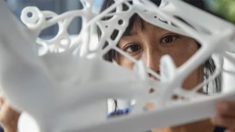 female engineer with 3D manufacturing part