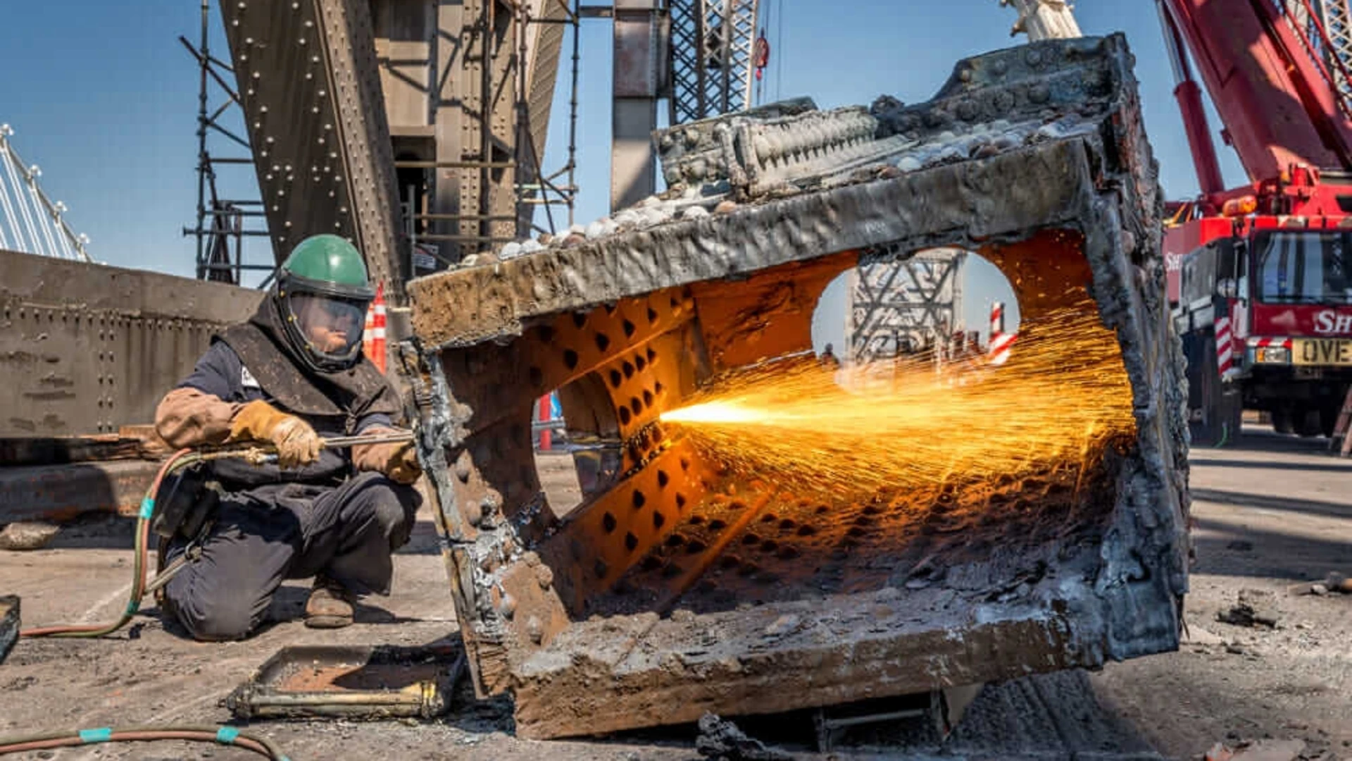 A worker works on the Bay Bridge disassembly