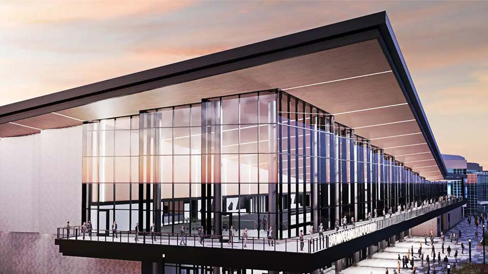 A smaller version of the banner image, shows an image of a building with a city skyline in the background