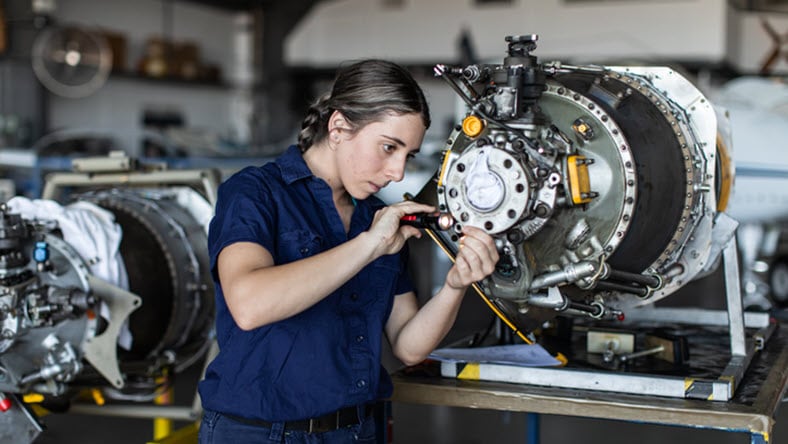 Engineer working on plane turbine