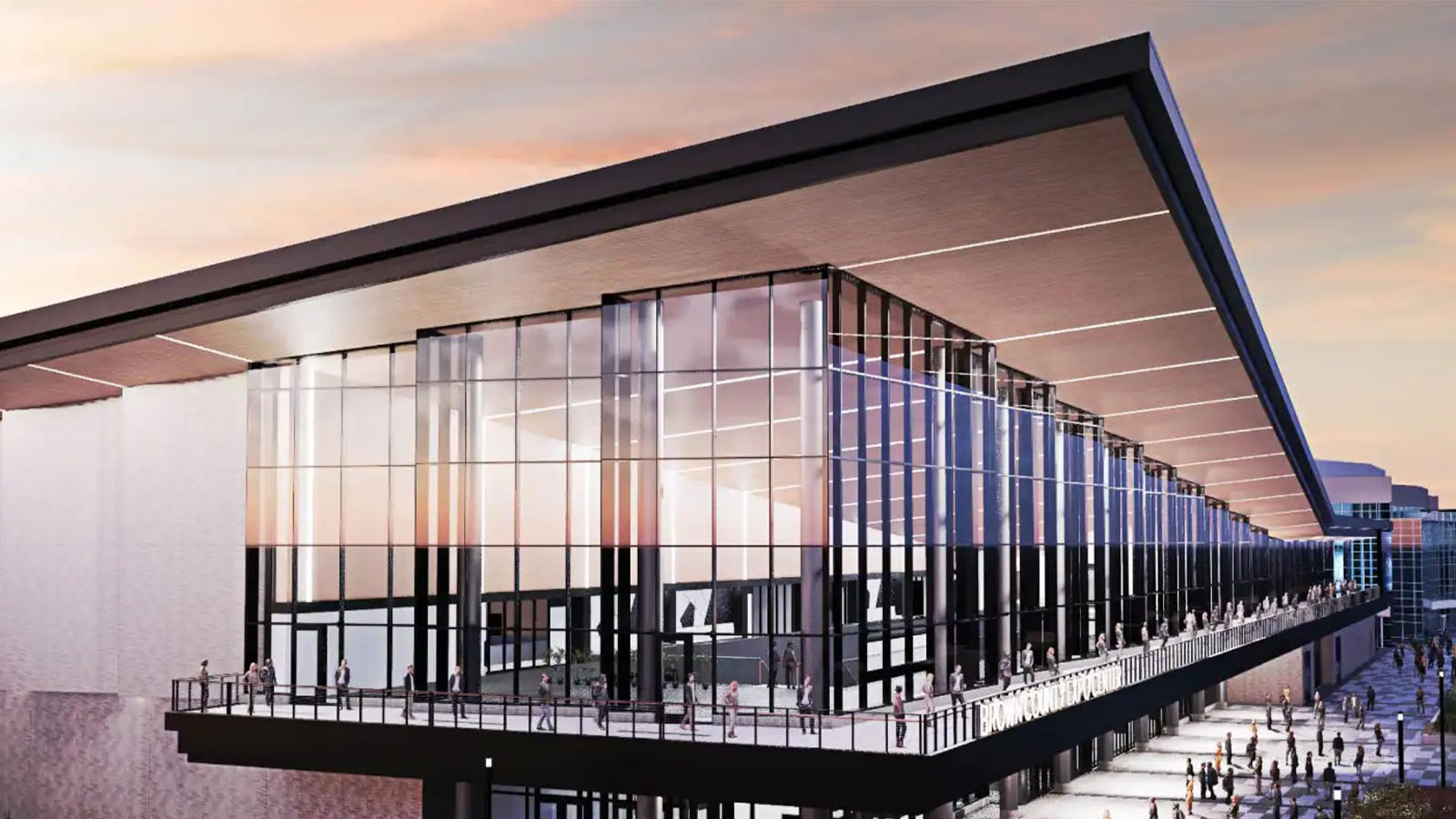 An image of a building in the foreground, with a city skyline behind it