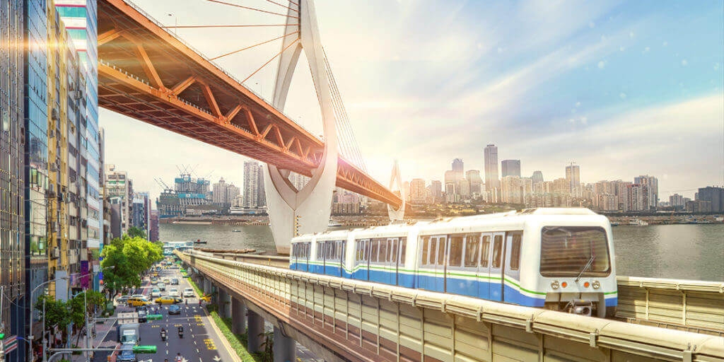 Train passing under bridge