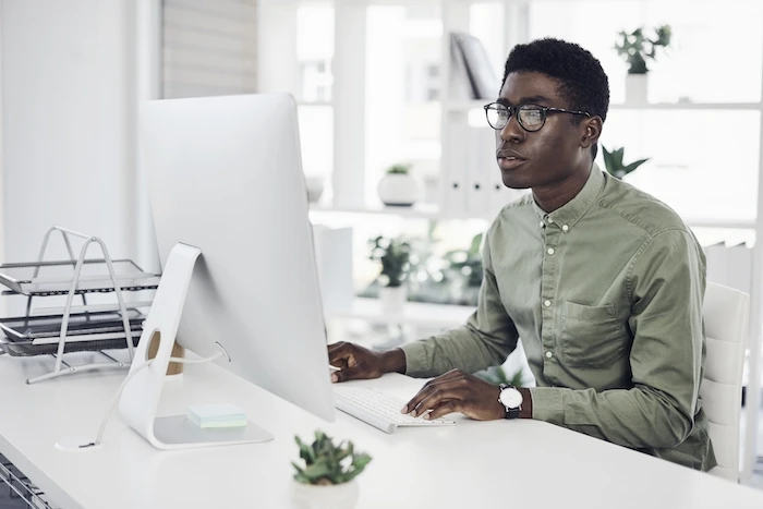 Young businessman working on a computer in an office