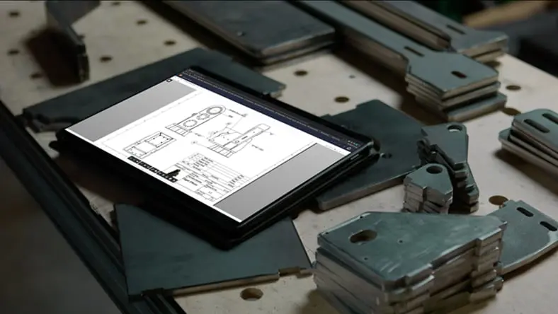 Sheet metal design software showing flat metal parts with consistent thickness. Defines bend radii, relief sizes, and automatically applies them during design. Creating flanges adds bends automatically for manufacturing.