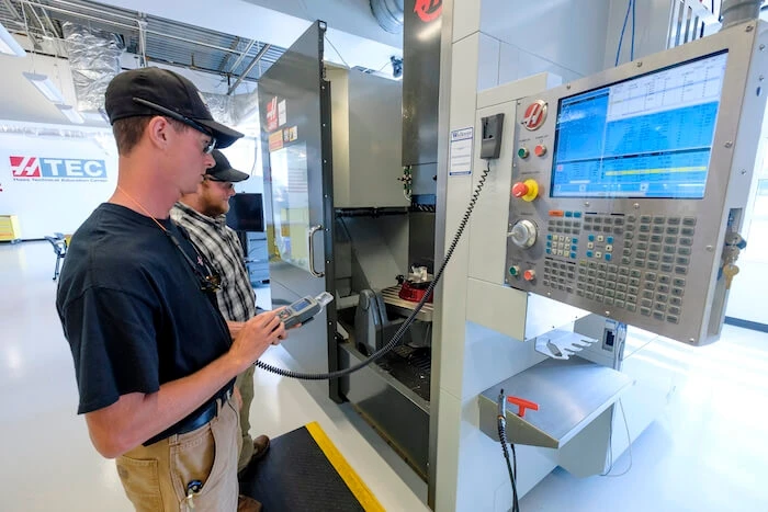 Advanced manufacturing training Gene Haas center students in precision-machining training model