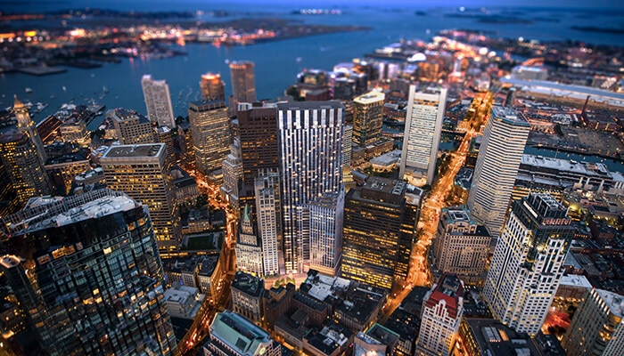 passive house design winthrop center skyline at night in boston