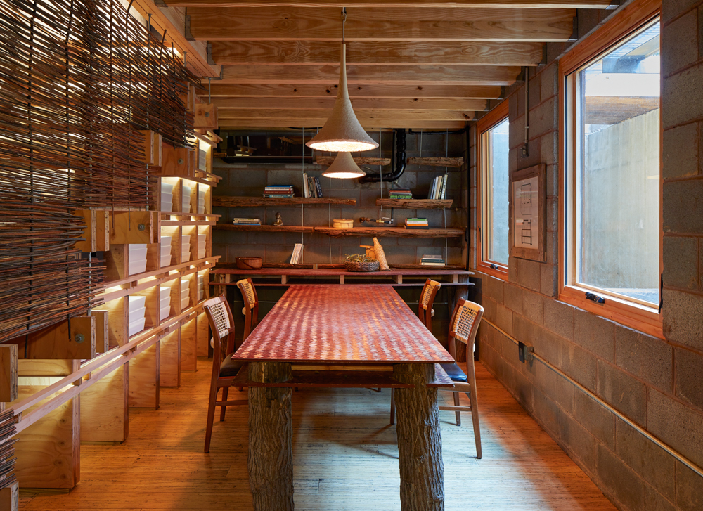 Dining room with wood floors and bookshelves