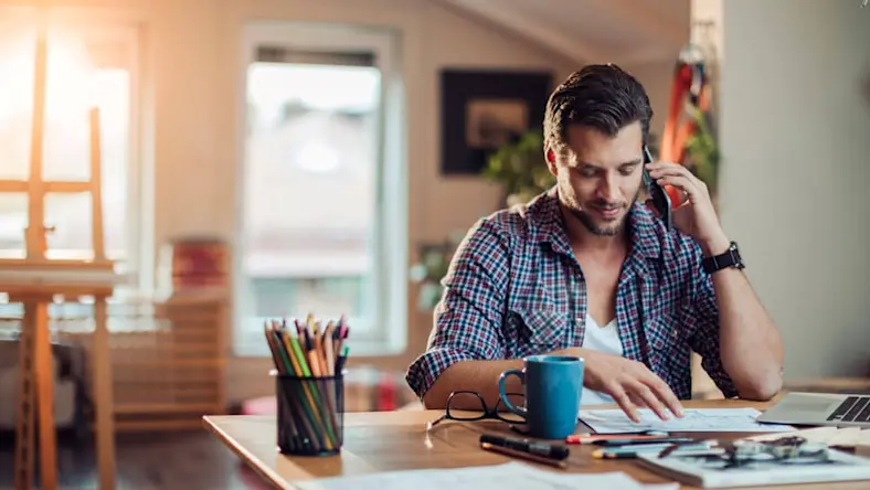 A man works from a home office.
