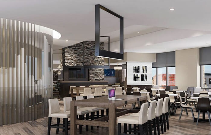 Rendering of interior hotel space with many tables and chairs