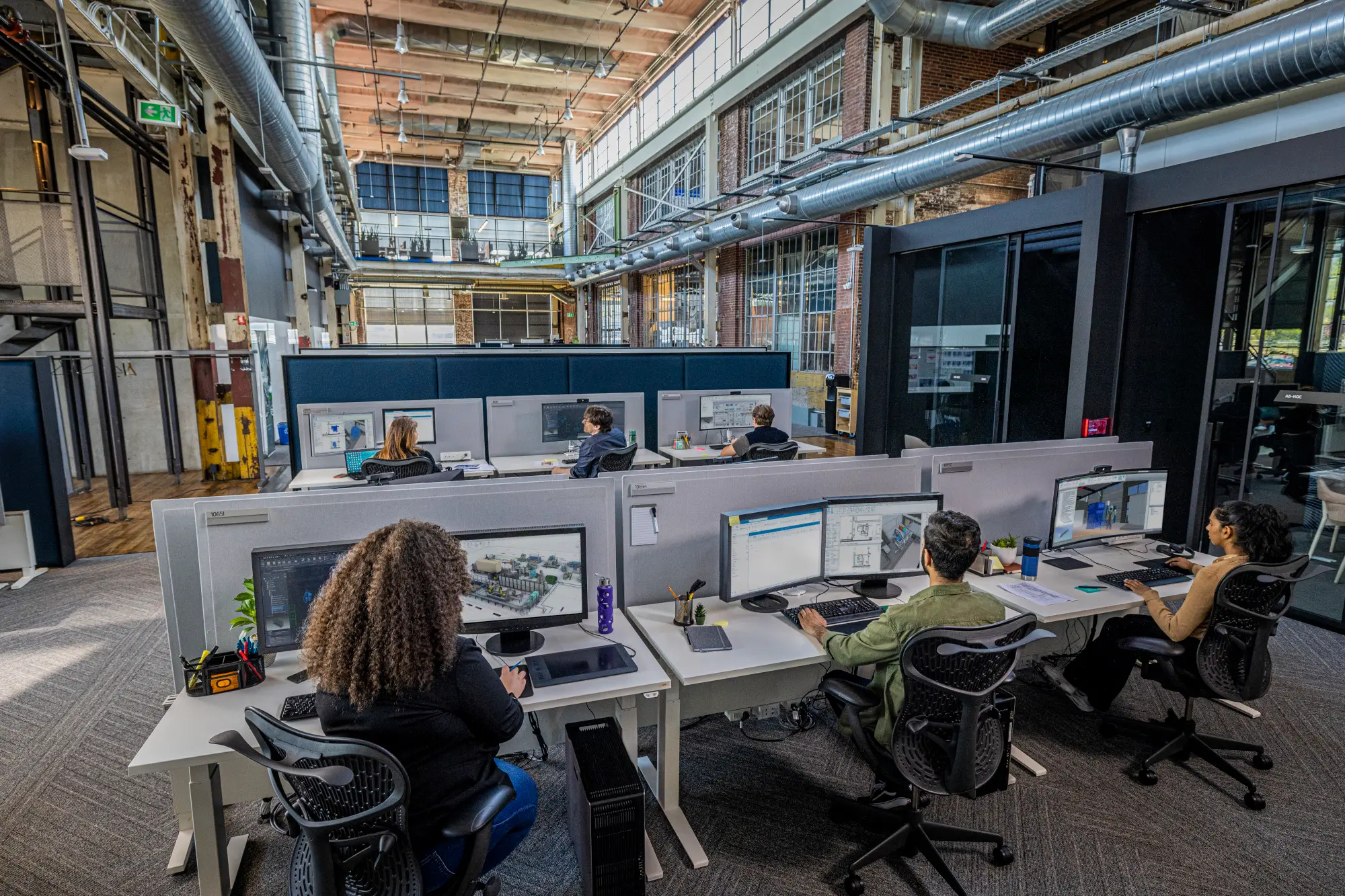 People working at desks in an office