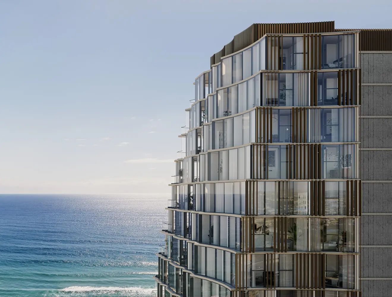 building with glass windows beside the ocean
