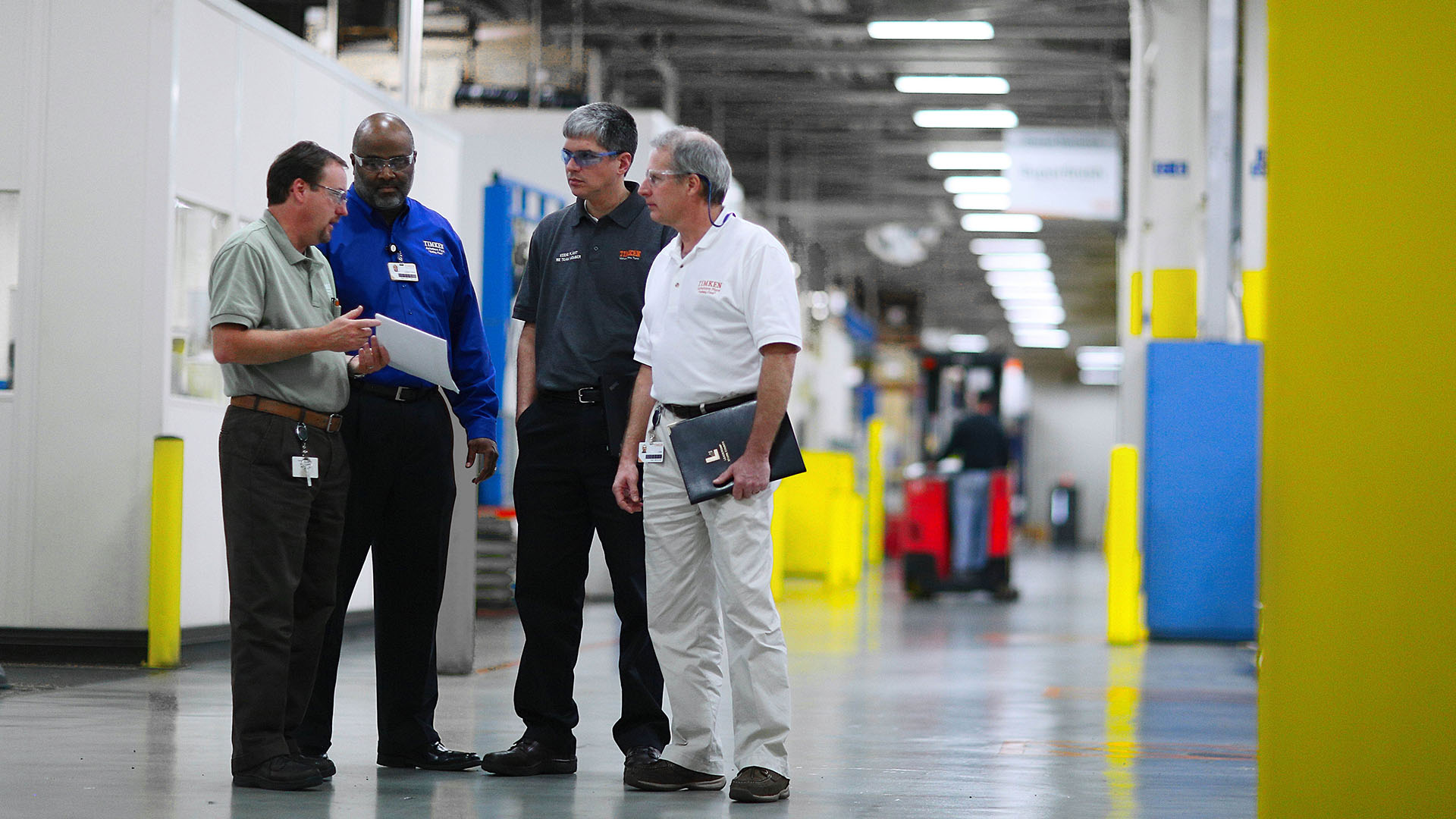 Team members speaking at a Timken plant.