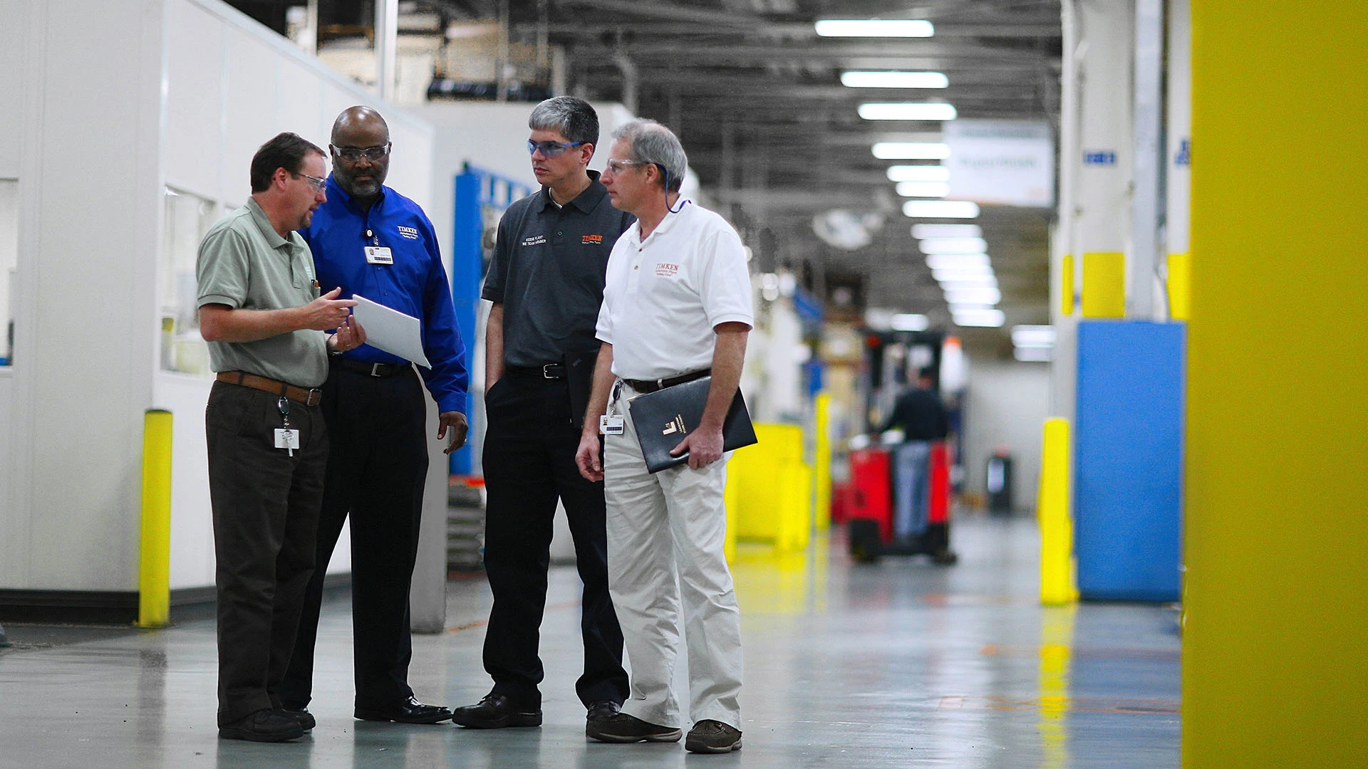 Team members speaking at a Timken plant.