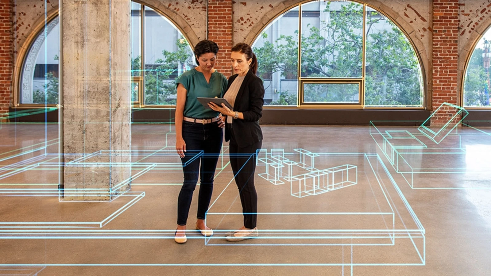 two workers collaborate in an office with a digital design overlay over the photo