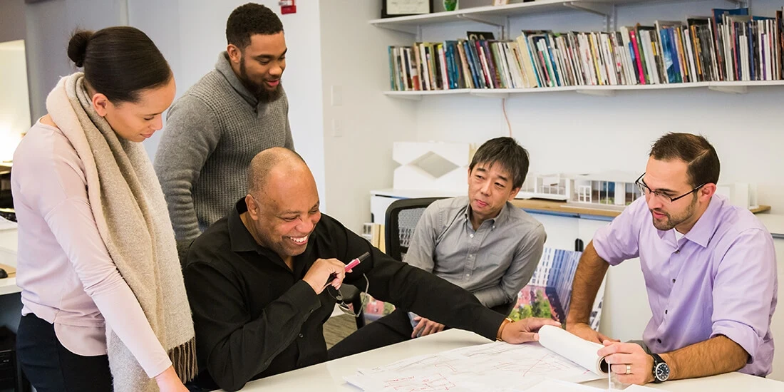Group of architects looking at plans