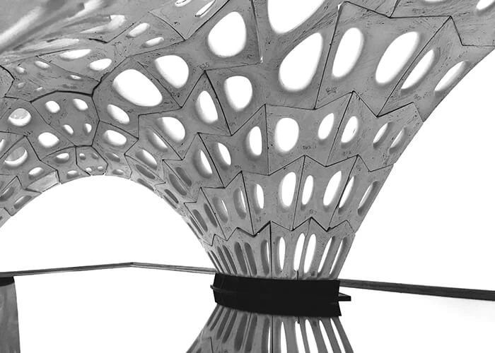 Multiple angular panels converge in a sculpture.