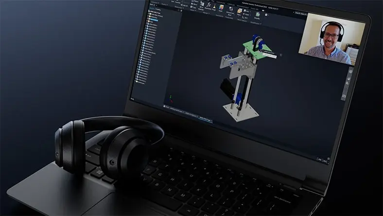 Open laptop with headphones showing an image of an on-demand webinar