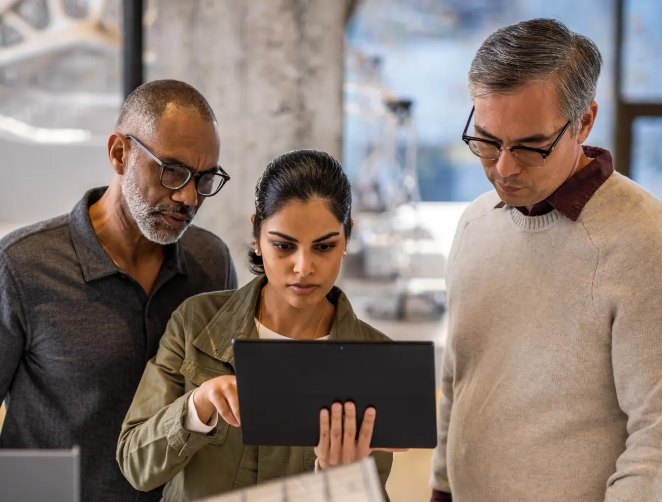 Water professionals looking at a hydraulic model on a tablet