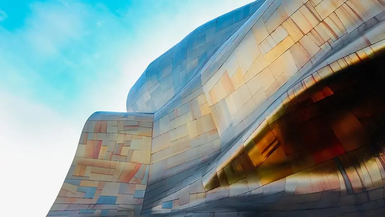 A metal building facade shows off its curves.