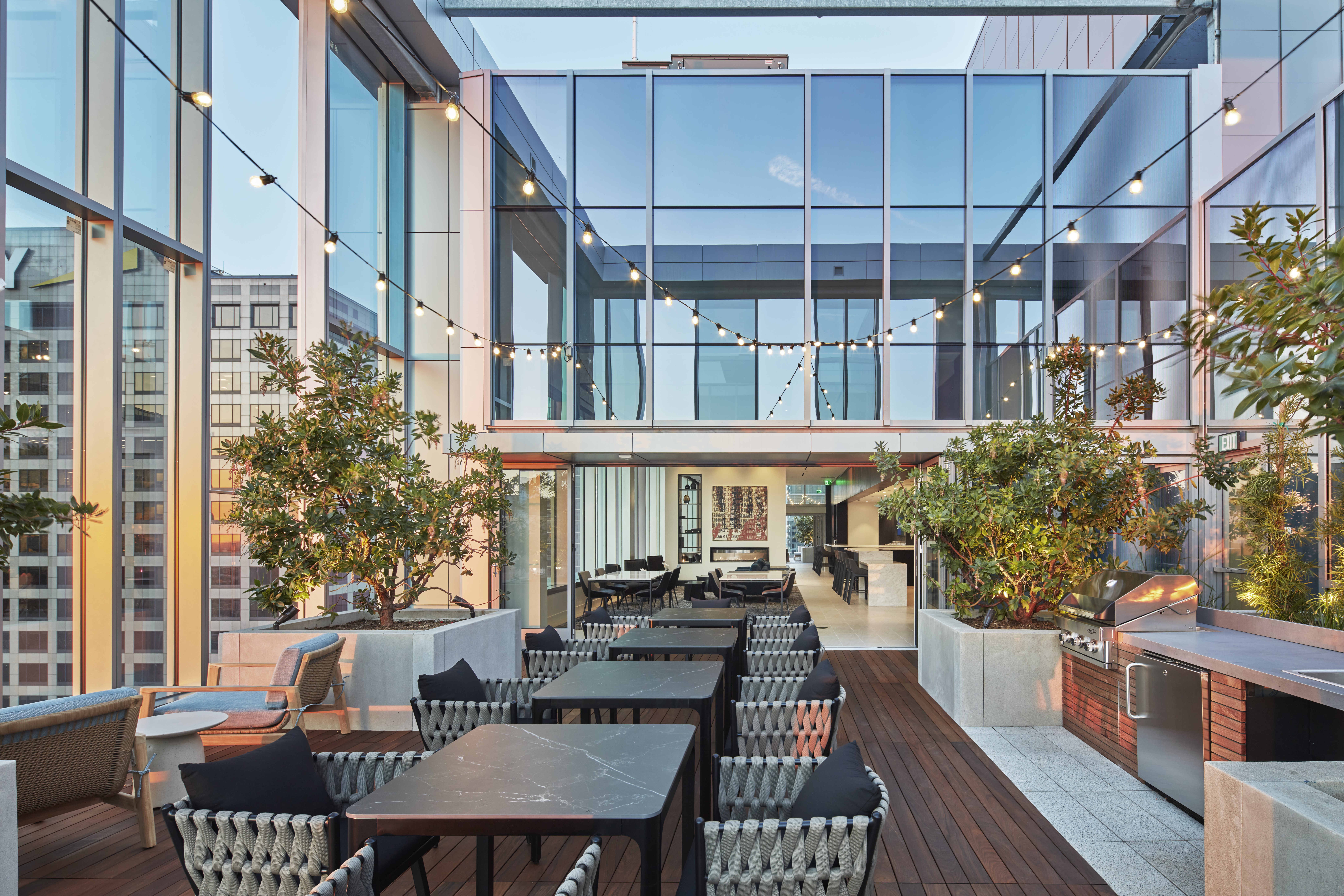 Rooftop deck with barbecue grills and tables and chairs