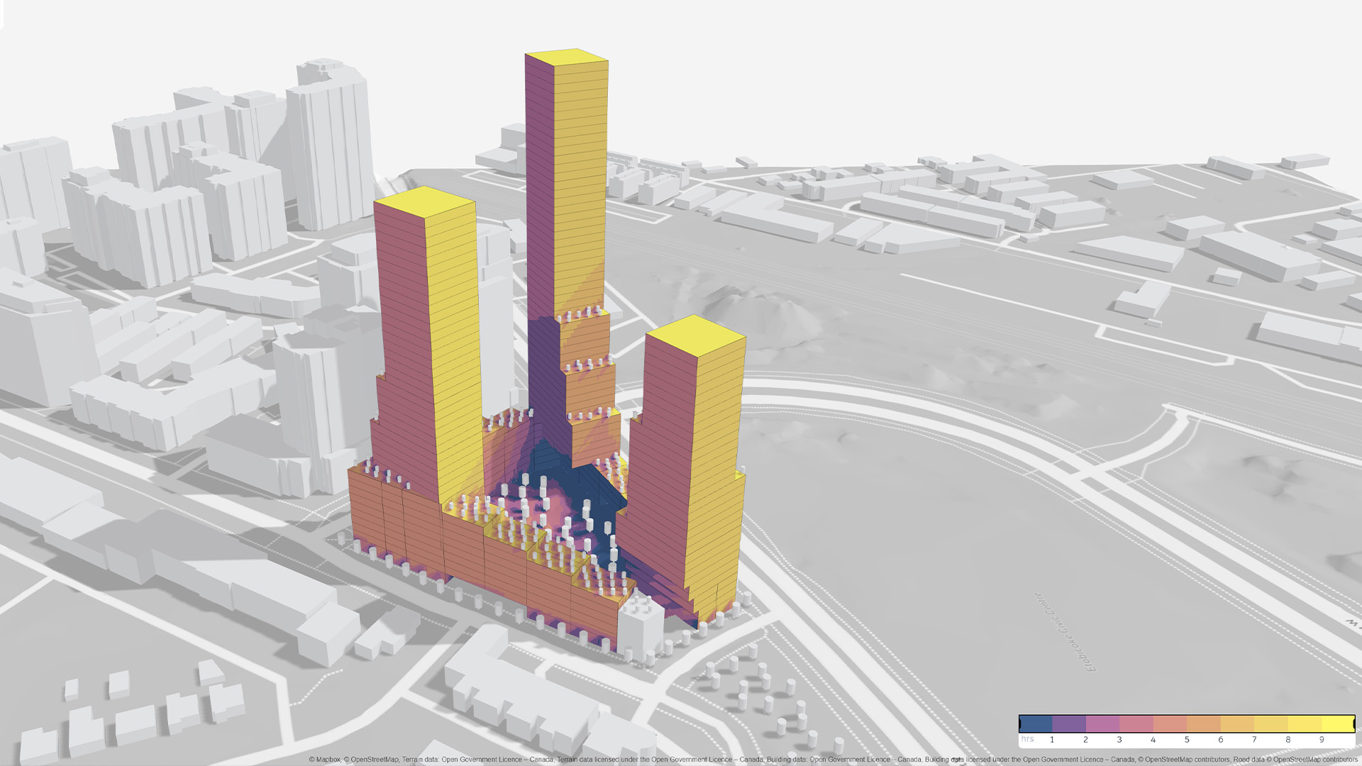 3D model of tall buildings with color-coded shading showing sunlight exposure, surrounded by roads and smaller structures.