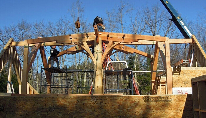 Mass timber building hybrid log frame