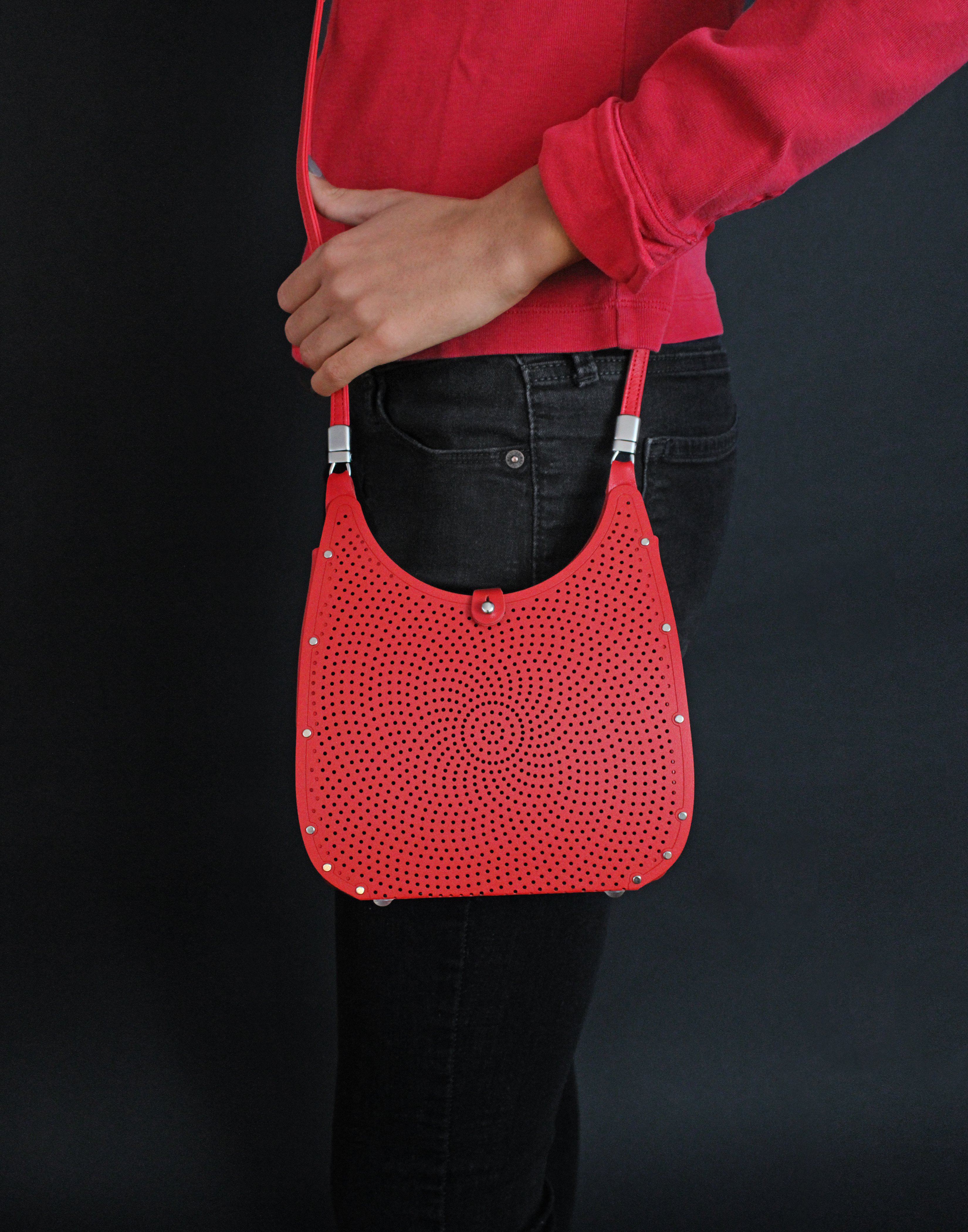 Metal handbag worn by a female