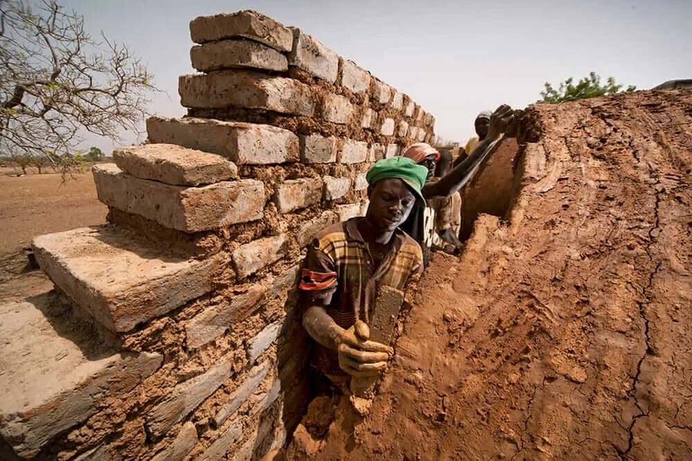 masons on African nubian vault building site