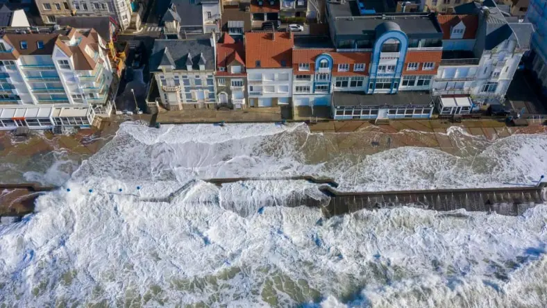 Carbon removal aerial shot of dike in France submerged by tides