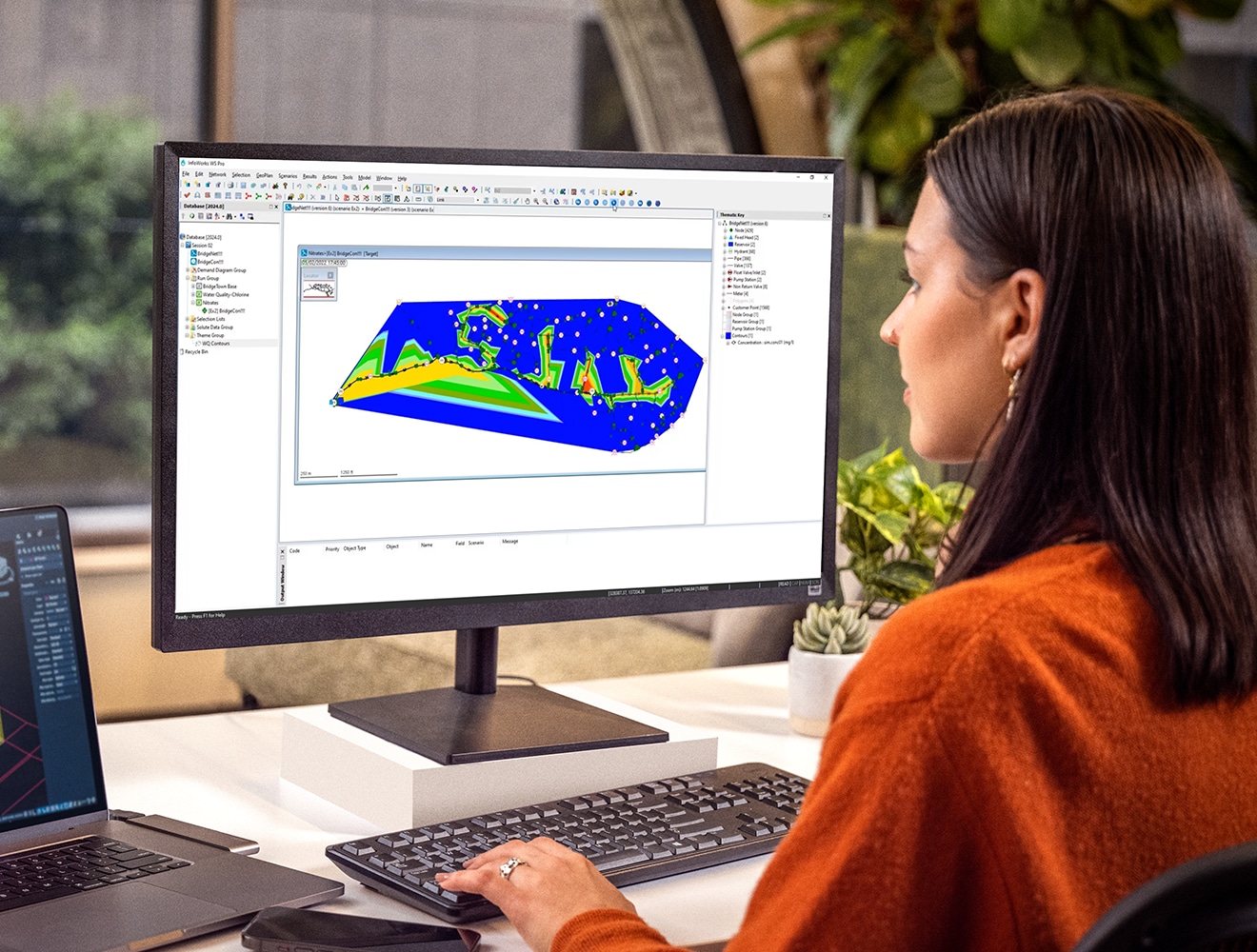 Women sat at a computer using InfoWorks WS Pro software