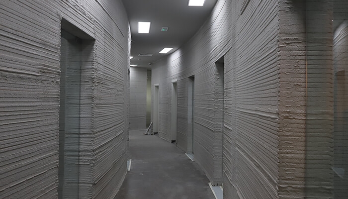 3D-printed concrete walls by Apis Cor