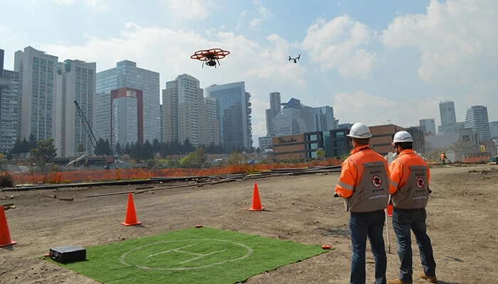 A pair of Consorcio IUYET workers use drones for geolocation