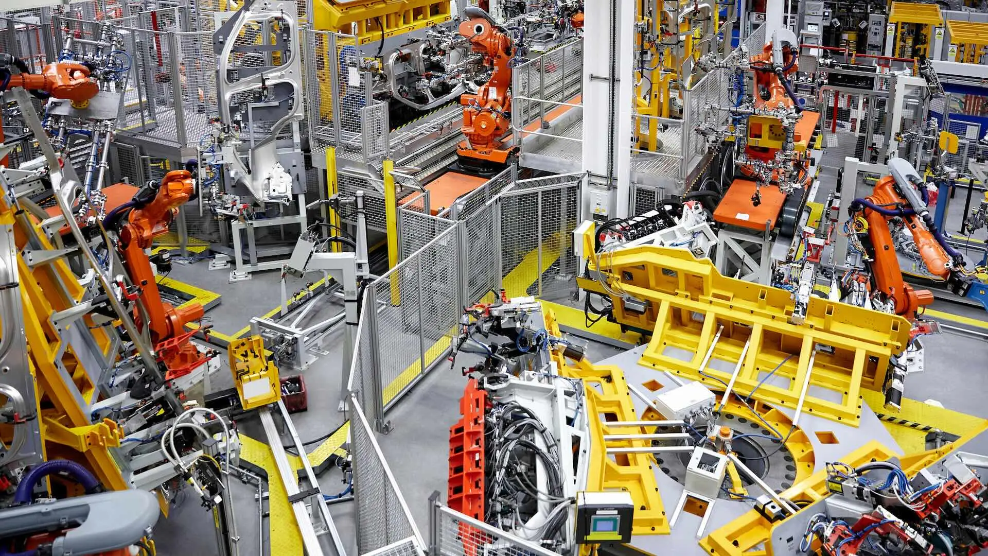 View of a factory floor showing modern robotic and automation equipment.