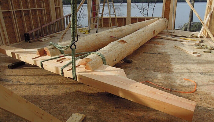 mass timber building assmbling hybrid log frame