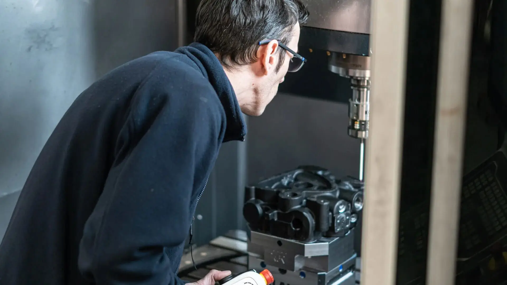 Man using CNC machine.