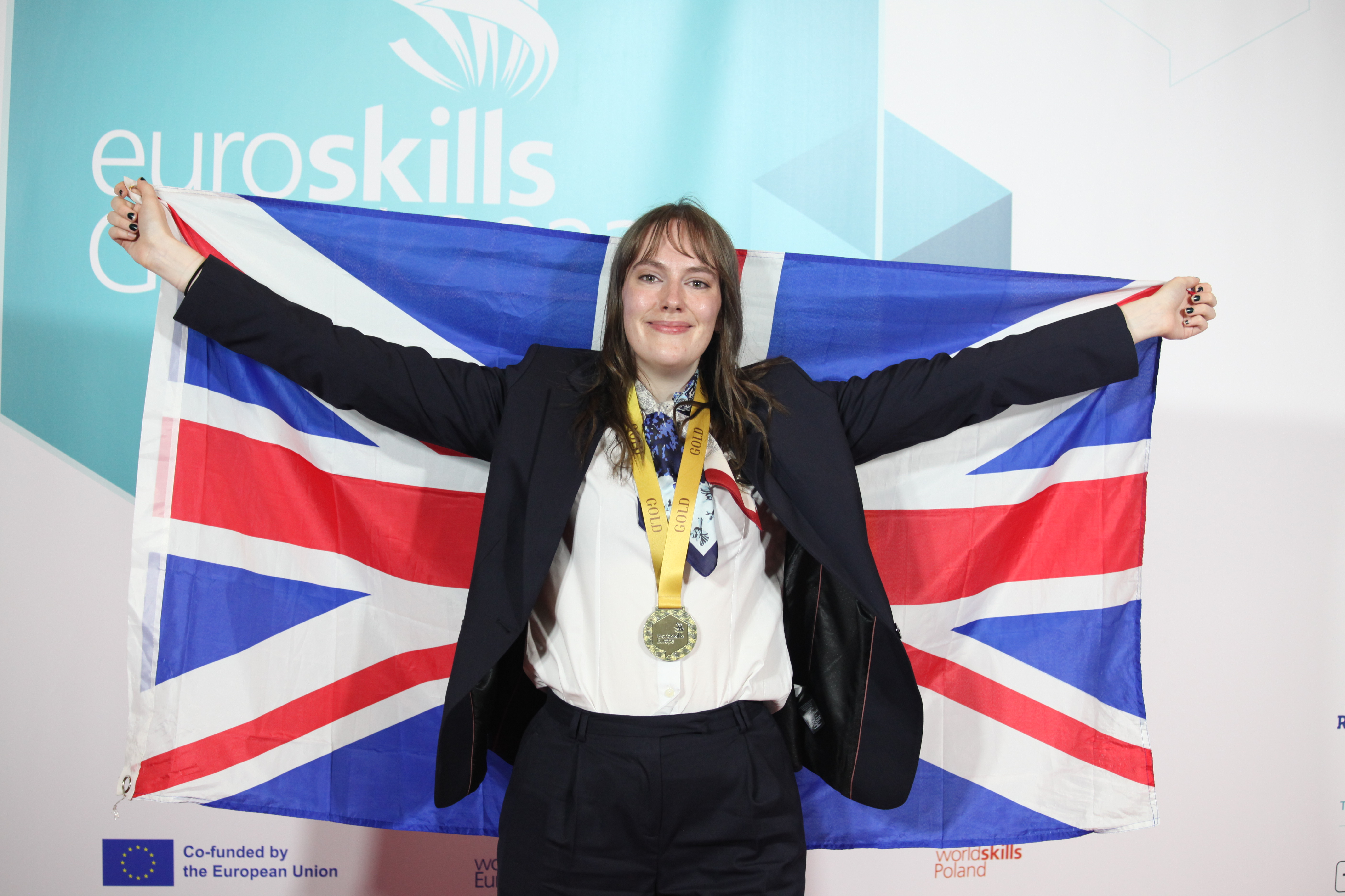 Image of Isabelle Barron wearing her gold medal at EuroSkills 2023