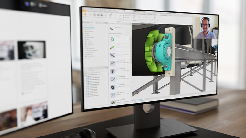 Computer monitor displaying conveyor model and webinar speaker