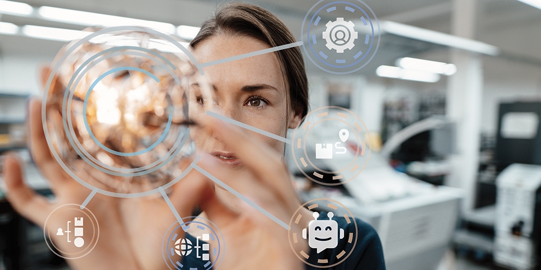 Collage image of woman manipulating a digital graphic overlay manufacturing trends 2022