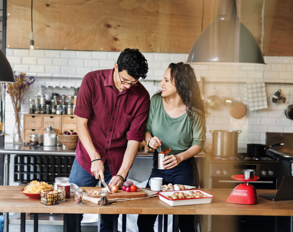 couple-laughing-while-they-prepare-a-meal-i-screen