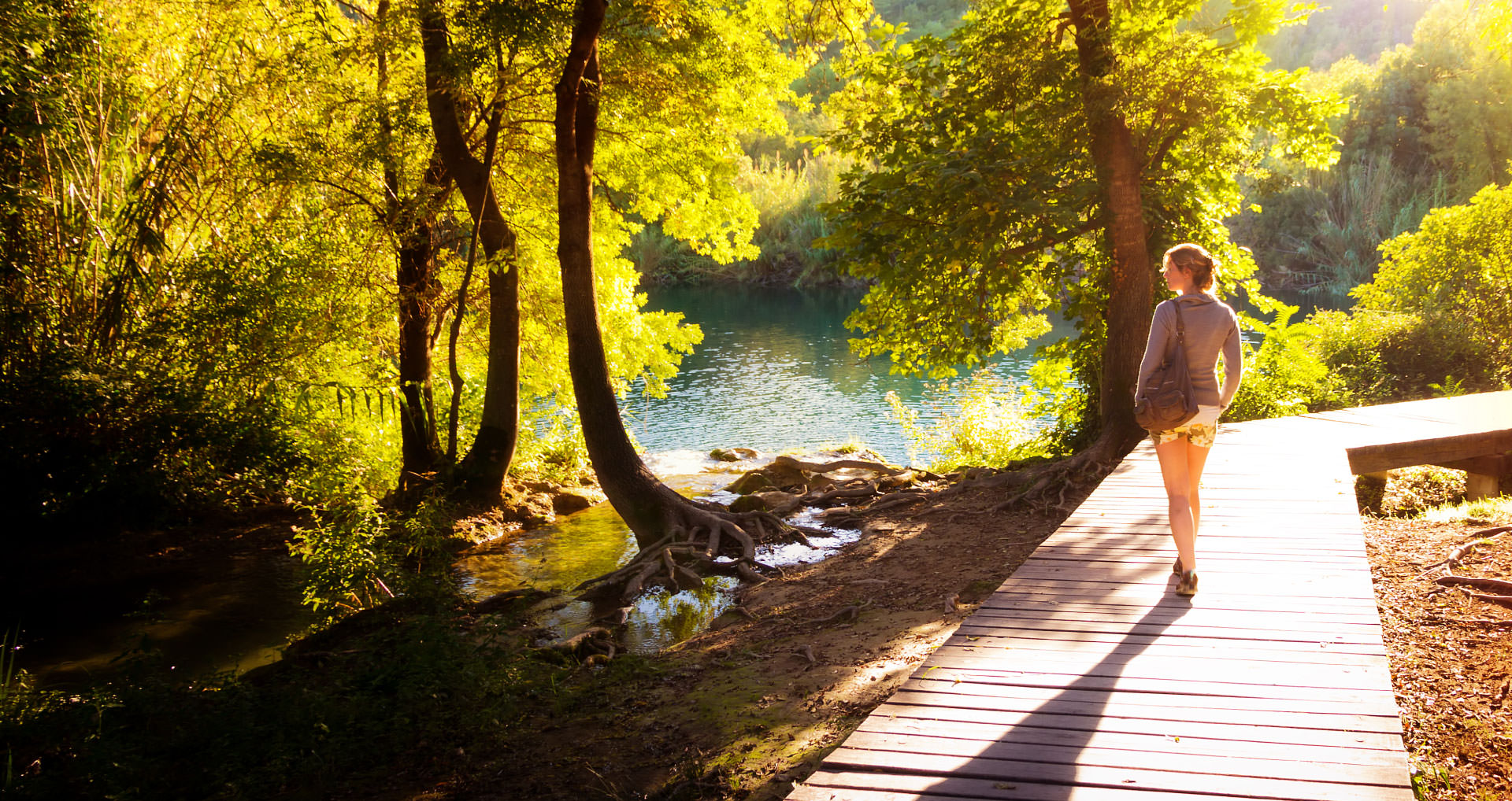 woman-walking-on-a-shaded-walkway-i-screen